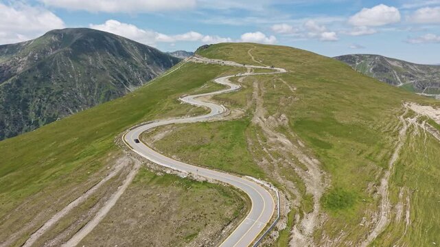 Winding Summit Road Across Transalpina Plescoaia Grassland