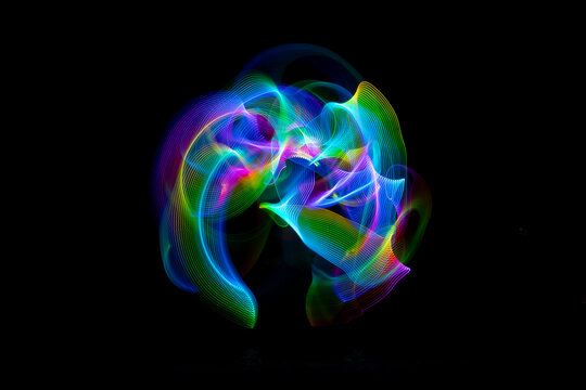 Colorful led light painting creating vibrant trails on a dark
