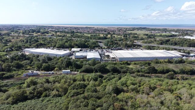 Aerial drone 4K scene showing Wallasey housing blocks glowing under warm sunlight Wallasey UK