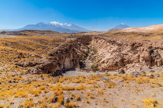 A view down into the entrance to the Culebrillas canyon with Chachani volcano as a backdrop close to Arequipa, Peru in the dry season