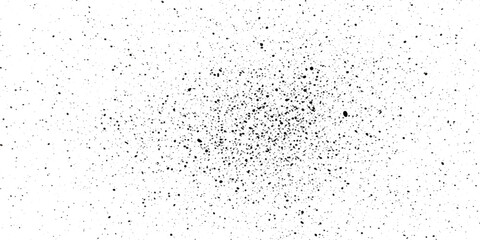 Naklejka premium A dynamic explosion of fine black and white ink splatter creates an abstract and energetic background, perfect for modern design.