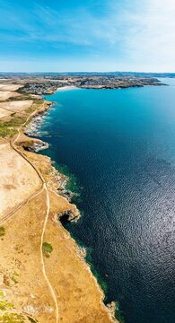 Panorama of Pentire Point and Bay over Padstow Bay from a drone, Polzeath, Cornwall, England, Summer 2026