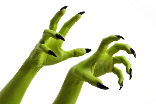 Creepy green monster hands with elongated fingers and sharp black claws reaching forward in a dramatic Halloween horror concept.