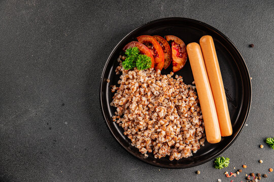Buckwheat porridge with sausages food preparation dish tasty snack fresh and delicious gourmet rustic food background on the table&nbsp; rustic food top view copy space