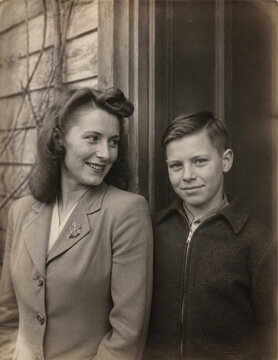Warm 1940s portrait of a mother and teenage son