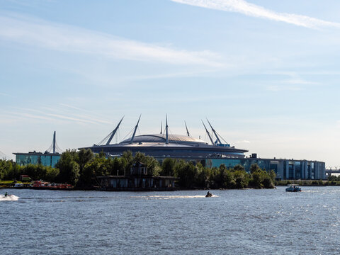 Saint Petersburg, Russia - July 31, 2026: view of Krestovsky Stadium (Gazprom Arena) from western spit Yelagin Island on sunny summer day in Saint Petersburg city, Russia on sunny summer day