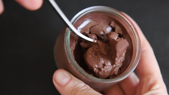 Chocolate pudding glass jar Chocolate mousse sweet dessert, natural ingredients food preparation tasty snack fresh gourmet food background on the table rustic food top view copy space