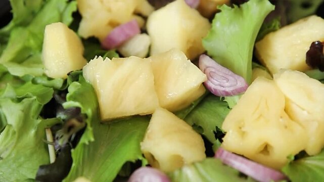 Pineapple salad mixed green salad leaves and pineapple chunks food preparation tasty snack fresh gourmet food background on the table rustic food top view 