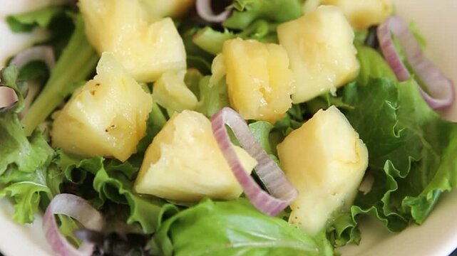 Pineapple salad mixed green salad leaves and pineapple chunks food preparation tasty snack fresh gourmet food background on the table rustic food top view 