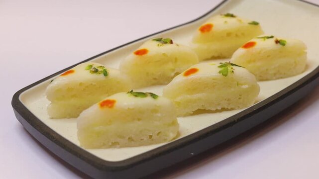 Malai sandwich or malai cham cham beautifully plated on white plate