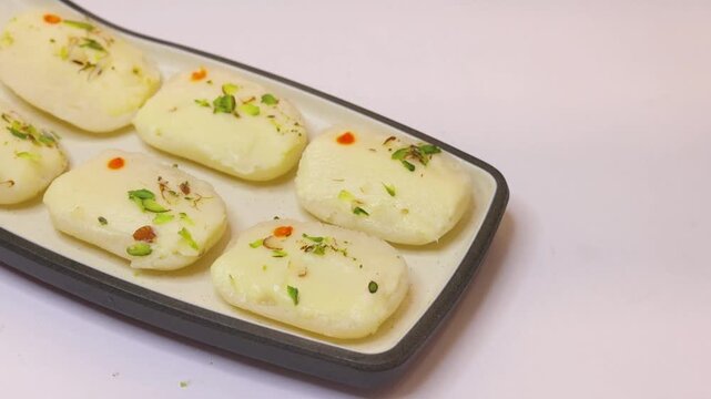 Malai cham cham sweet beautifully placed on white background 