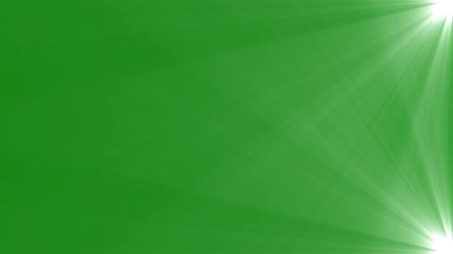 Right side dual optical spotlight flare overlay with glowing light rays on solid green screen backdrop.
