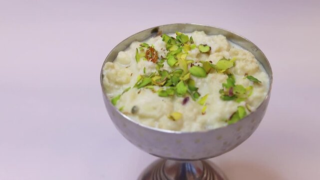 Rabdi made with milk garnished with pista 