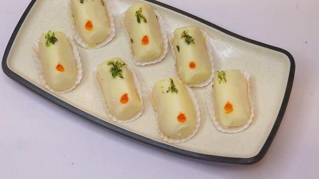 Malai cham cham sweet beautifully placed on white background 