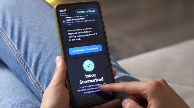 Smartphone user reviews an AI-powered inbox summary that identifies priority messages and prepares a reply, reflecting the shift toward automated email productivity.