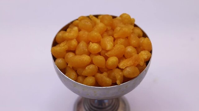 Boondi or nukti in a silver cup on white background 