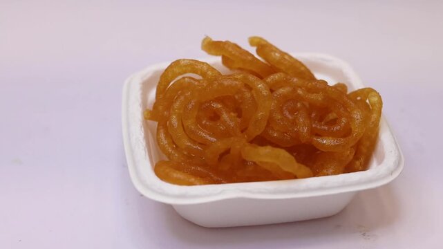 Imarti or jalebi an indian dessert fried in oil then dipped in sugar syrup