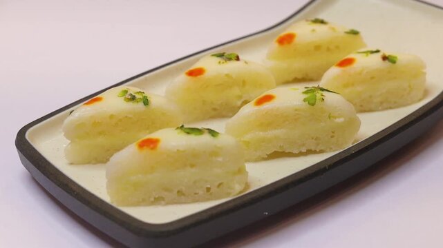Malai sandwich or malai cham cham beautifully plated on white plate