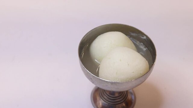 Rasgulla an indian dessert white balls dipped in sugar syrup
