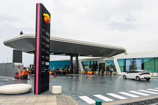 MORRO JABLE, FUERTEVENTURA &ndash; JULY 23, 2026: Repsol service station with curved canopy, glass‑front building, fuel price totem, vehicles and modern coastal infrastructure.