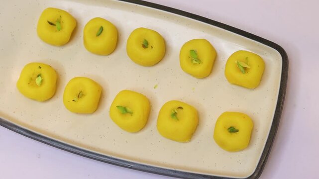 Malai Peda or white pera is a North Indian sweet Mithai or delight prepared with full cream milk sugar and cardamom