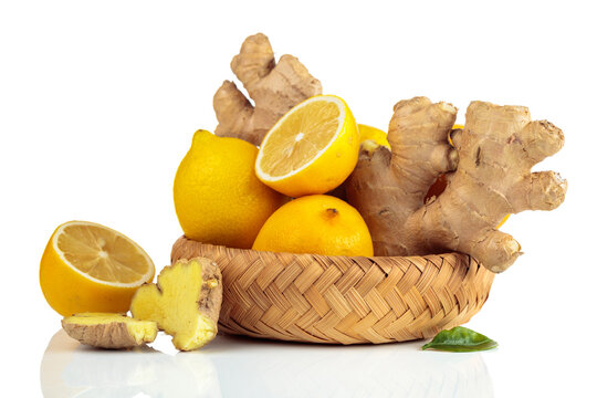 Fresh lemons and ginger roots isolated on a white background.