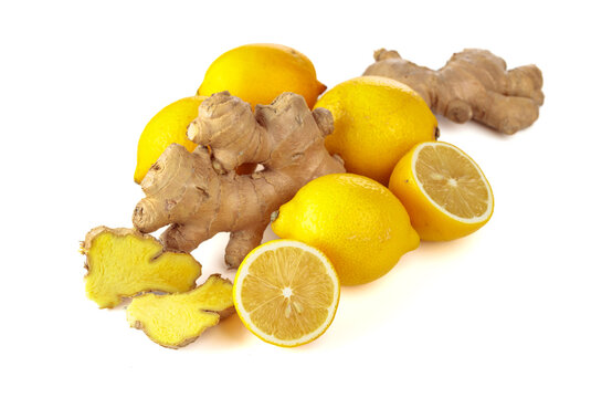 Fresh lemons and ginger roots isolated on a white background.