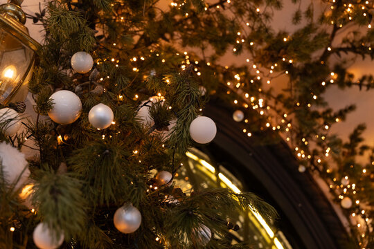 Decorations with lights and Christmas ornaments in holiday setting at a gathering place in winter
