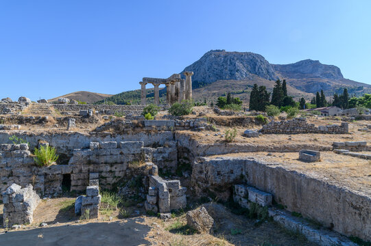Doric columns of the Temple of Apollo with Acrocorinth rising behind, Ancient Corinth, Greece