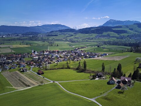 View of the village with the Alps with the Rigi in the background, Dietwil, Freiamt, Canton of Aargau, Switzerland