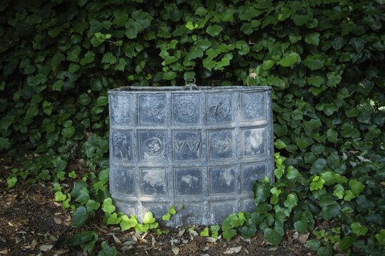 Old lead container dating from 1670, presumably for compost, Chelsea Physic Garden, historic botanical garden, oldest botanical garden in London, founded in 1673 by the Worshipful Society of Apothecaries, Chelsea, England, Great Britain