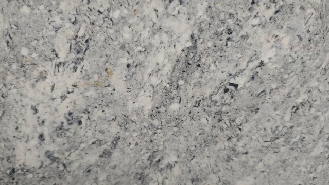 Grey granite stone surface texture with speckled mineral pattern background