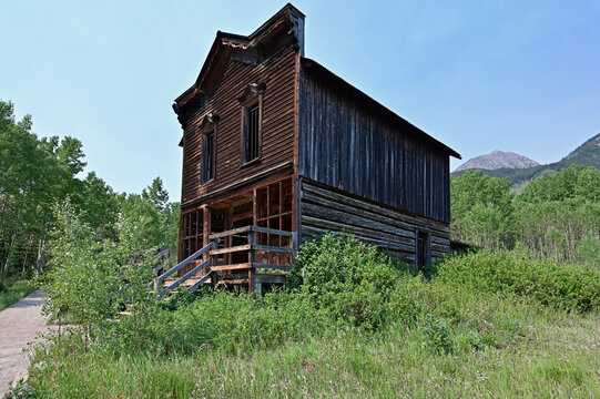 Long abandoned buildings of Ashcroft Ghost Town in Castle Creek Valley near Aspen, Colorado on sunny summer morning.
