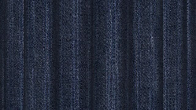 Revolving presentation of Italian deep navy chalk stripe wool fabric rolls showing bold wide line pattern and high end executive suiting background
