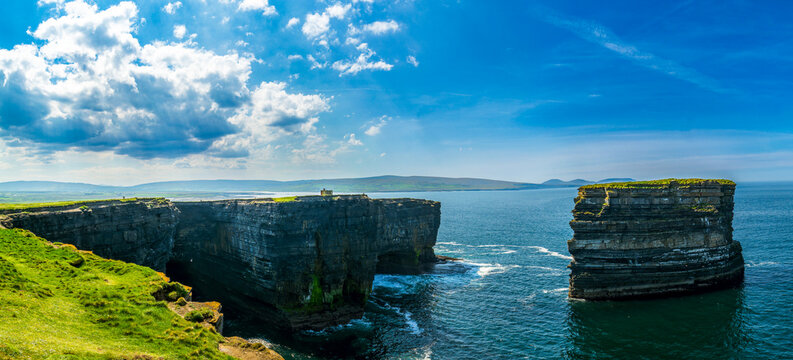 Panoramic aerial view of Dun Briste sea stack and dramatic ocean cliffs at Downpatrick Head in County Mayo, Ireland