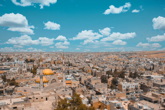Wide skyline of Madaba Jordan beneath clouds