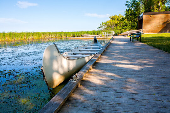 Solo canoe solitary marsh scene on boardwalk