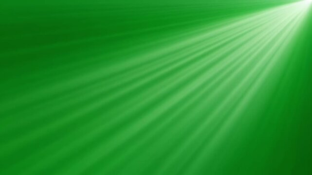 Vibrant green light rays shining diagonally across a dark textured background creating an energetic and glowing futuristic abstract visual effect
