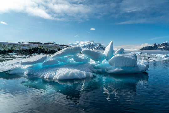 Antarctica, antarctic Peninsula. Sunlight penetrates the ice floes and creates radiant colors. in the Lemaire Channel.  In February 