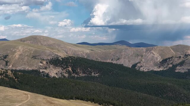 Aerial of mountain landscape with forest and dramatic storm front in Colorado near keystone Colorado