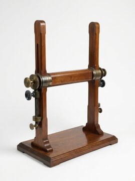 Antique wooden lab stand with adjustable vertical pillars and metallic thumbscrews