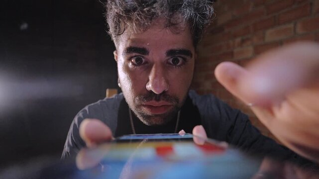 Man Doomscrolling on Smartphone with Distressed Expression