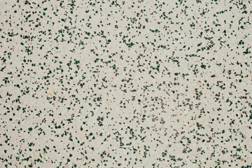 Naklejka premium Beige terrazzo texture with dark green and grey stone chips