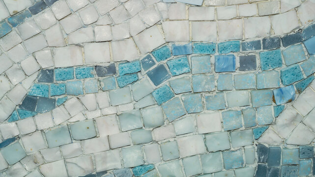 Macro of blue white and turquoise glass mosaic with wavy pattern