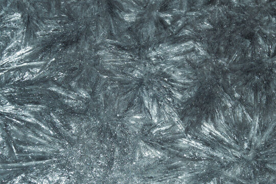Abstract sharp macro texture with cold blue-grey metallic tones