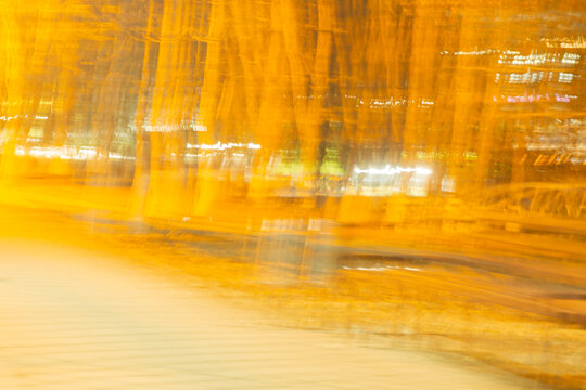 Abstract orange light trails and blurred city night motion
