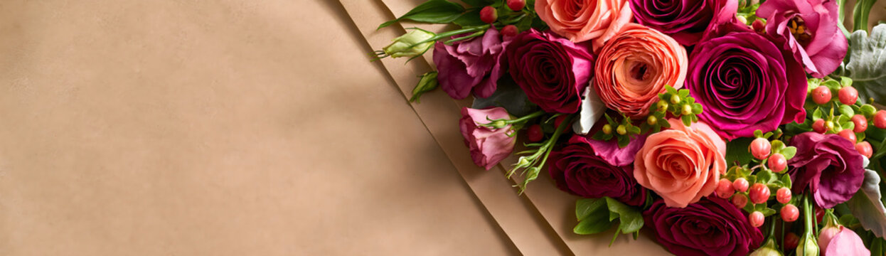 Fresh cut bouquet lying open on kraft wrapping paper