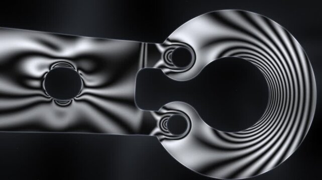 Photoelastic Stress Fringes Sweeping Across a Transparent Loaded Part Under a Dark-Field Polariscope, Seamless Loop in cool gray tones