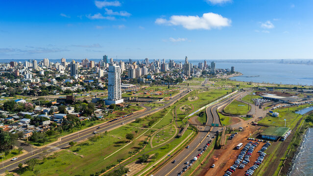 Aerial cityscape of Posadas skyline along the Parana River near the Paraguay border crossing.