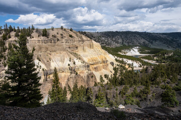 Fototapeta premium View of scenic cliff and canyon off the Grand Loop road in Yellowstone National Park, summer vacation destination for outdoor nature recreation 